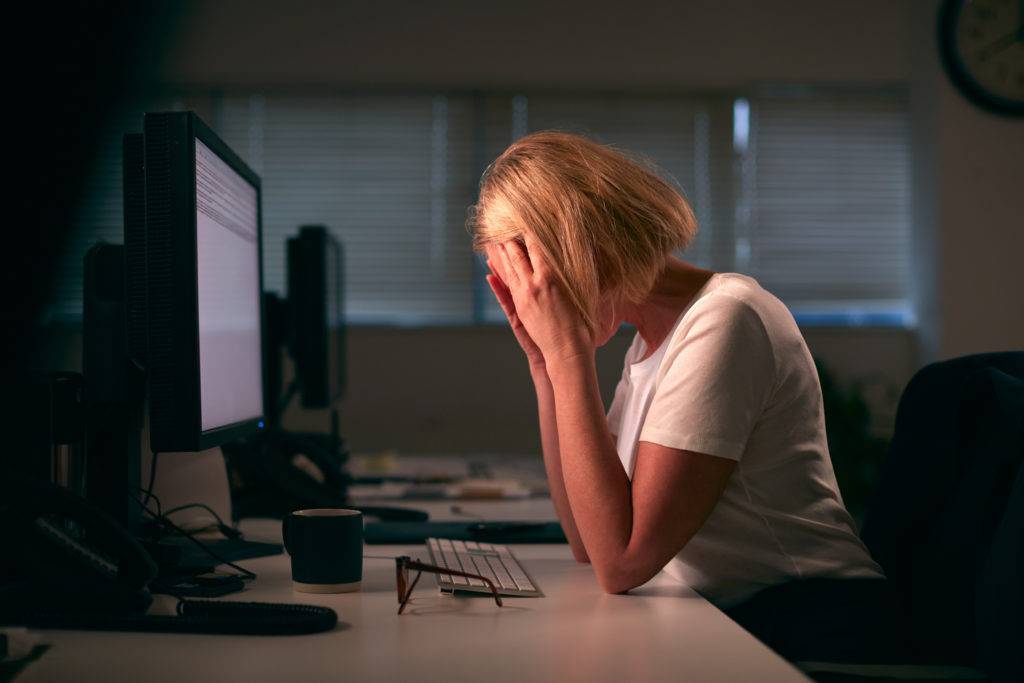 Stressed,Businesswoman,With,Head,In,Hands,Working,Late,At,Computer Stressed,Businesswoman,With,Head,In,Hands,Working,Late,At,Computer
