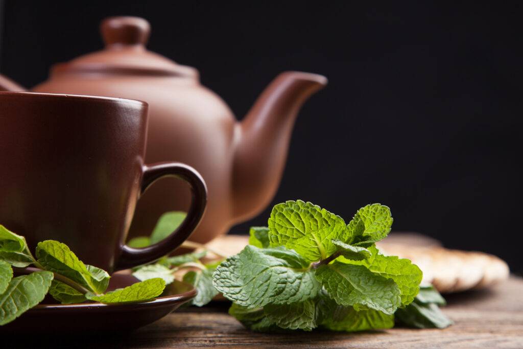 Tea,With,Mint,On,A,Wooden,Table,-,Studio,Still