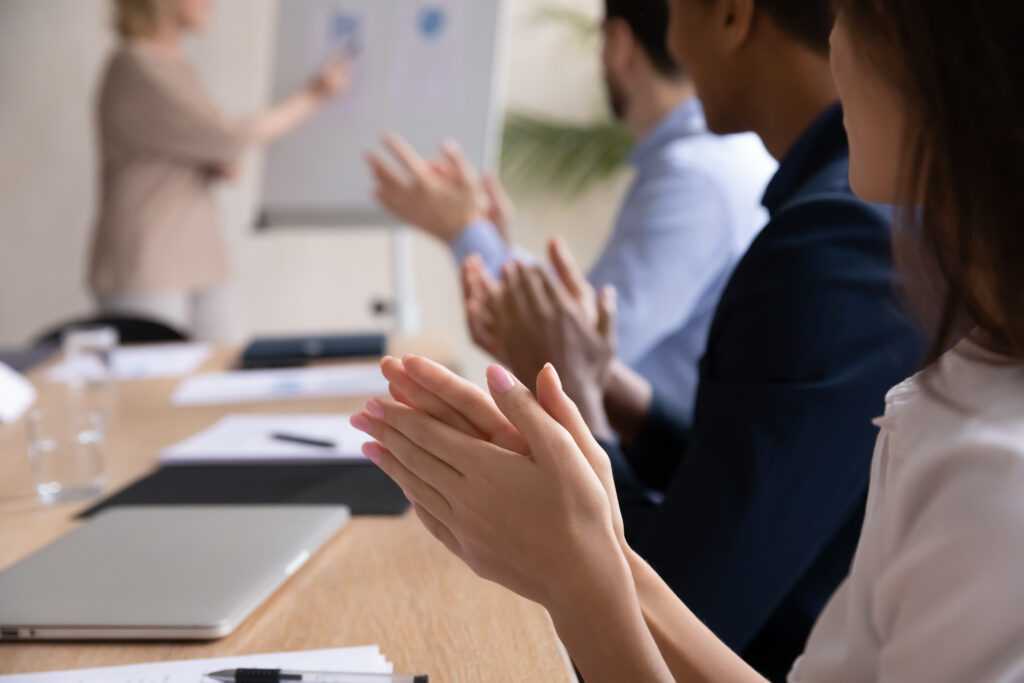 Close,Up,Smiling,Attractive,Businesswoman,Clap,Hands,With,Diverse,Colleagues