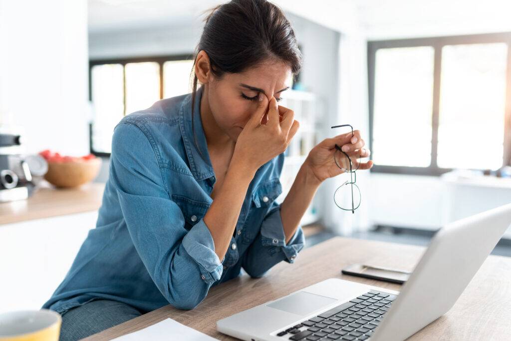 Shot,Of,Stressed,Business,Woman,Working,From,Home,On,Laptop