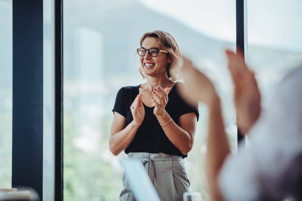 Businesswoman,Clapping,Hands,After,Successful,Brainstorming,Session,In,Boardroom.,Business