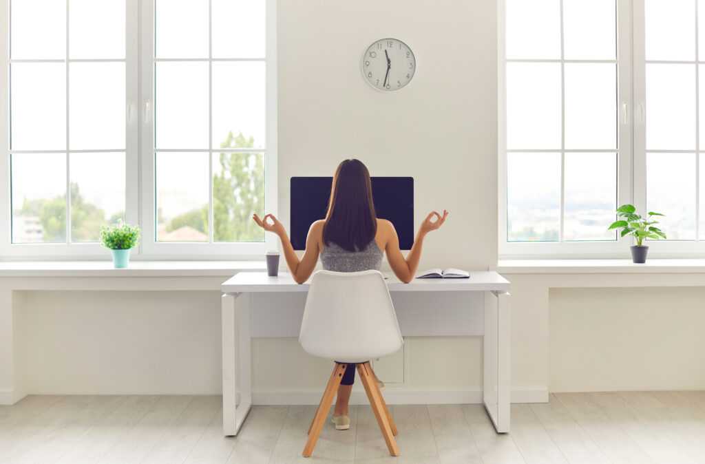 Back,View,Of,Woman,Taking,Break,From,Office,Work,And
