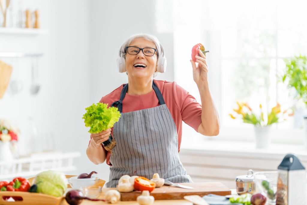 Healthy,Food,At,Home.,Happy,Woman,Is,Preparing,The,Vegetables