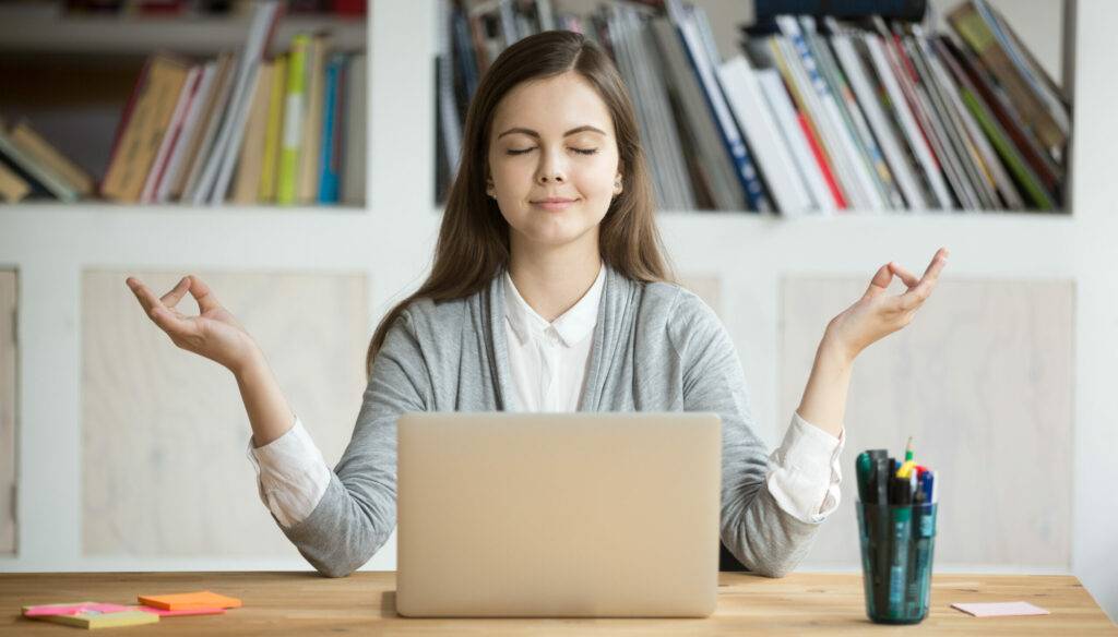 Calm,Woman,Relaxing,Meditating,With,Laptop,,No,Stress,Free,Relief